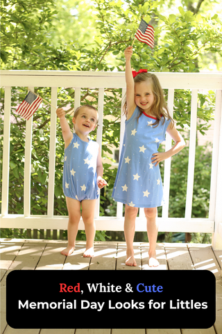 Two young children dressed in matching blue star-print outfits smile and wave American flags on a sunny porch, celebrating Memorial Day in patriotic style.