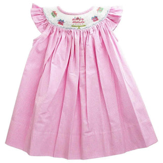 Pink gingham bishop dress with smocked birthday cakes and gifts, featuring angel sleeves and a full twirl-friendly skirt for girls.