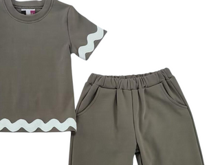 Children's outfit with a brown shirt and pants on a white background