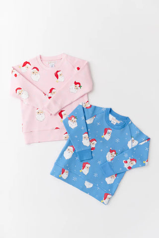 Matching sibling Cassidy Crewnecks by TBBC in pink and blue Dear Santa print. Holiday loungewear with Santa faces.