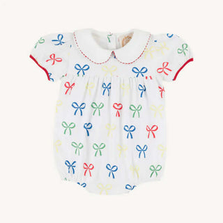 Baby bubble romper with colorful bows, red trim, and Peter Pan collar by The Beaufort Bonnet Company – heirloom-style Southern charm.
