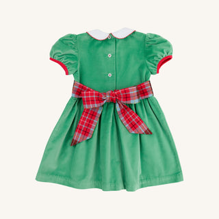Back view of green velveteen Cindy Lou Sash Dress with plaid bow and button details by The Beaufort Bonnet Company.