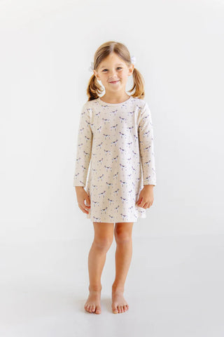 Girl wearing Long Sleeve Polly Play Dress in Carolina Hunt Club print by The Beaufort Bonnet Company, smiling in neutral studio setting.