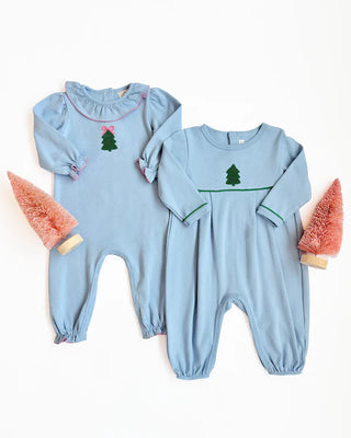 Bradford Romper in Barrington Blue with Christmas tree embroidery shown next to Ramona Ruffle Romper in coordinating sibling set.