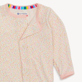 Close-up of Bedford Floral Modal  Magnetic Footie showing the pastel floral print on cream background and magnetic closure detail.