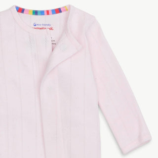 Close-up of Magnetic Me Love Lines Pink Pointelle Footie neckline and magnetic closure with pastel organic cotton fabric