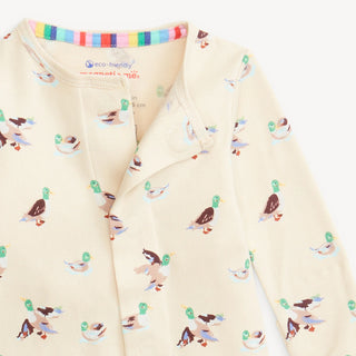 Close-up of Magnetic Me Quack Me Up Coverall neckline showing duck print on cream organic cotton and magnetic closure