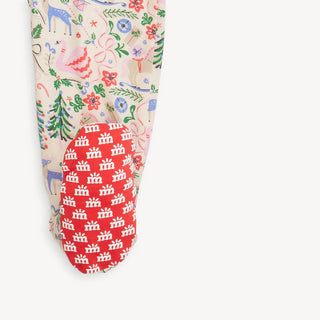 Close-up of Magnetic Me Sugar Plum Dreams sleeper foot grip with red sole and white crown print for added traction and style.