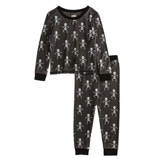 Boys glow-in-the-dark skeleton Halloween pajamas—black bamboo knit two-piece set with spooky print and comfy fit.