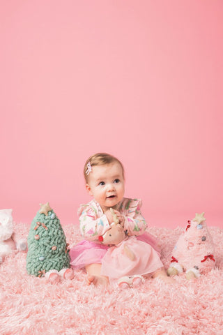 Mud Pie holiday plush pals including Santa, reindeer, green tree, and pink tree—soft, festive décor perfect for gifting or display.