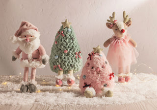 Mud Pie holiday plush pals including Santa, reindeer, green tree, and pink tree—soft, festive décor perfect for gifting or display.