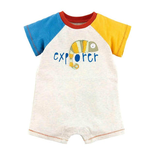 Colorblock baby shortall with iguana appliqué and "Explorer" text, features snap closure and raglan sleeves in blue and yellow.