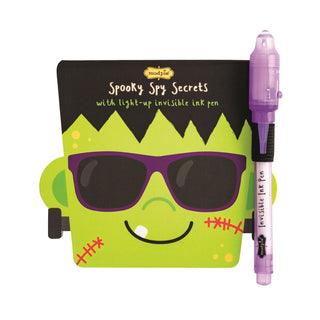 Halloween invisible ink pads with light-up pens—fun themed notebooks from Mud Pie in monster, pumpkin, and skeleton styles.