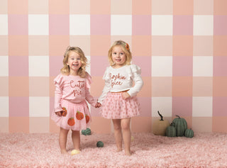 Pink pumpkin tutus for girls with gingham or all-over print designs—match perfectly with  pink and ivory tinsel tees.