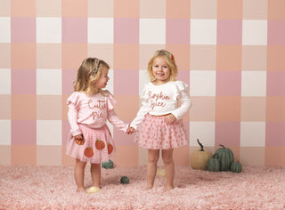 Pink pumpkin tutus for girls with gingham or all-over print designs—match perfectly with  pink and ivory tinsel tees.