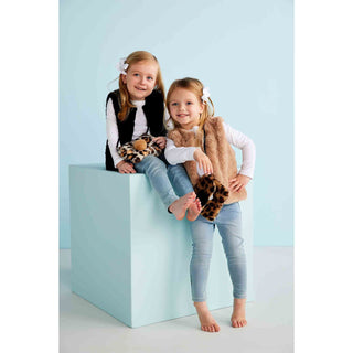 Girls’ taupe faux fur vest with hook-and-eye closure—perfect for layering over fall dresses, tops, or sweaters for cozy, classic style.