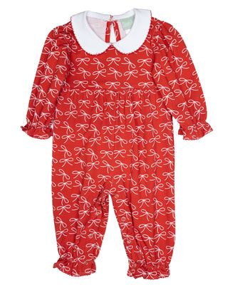 Red long-sleeve baby romper by Sage & Lilly with white bow print and scalloped collar trimmed in red with ruffled cuffs and ankles.