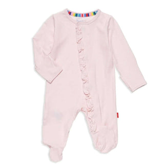 A pink long-sleeved baby footie with ruffles along the front and magnetic closures.