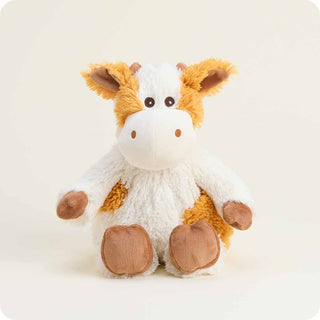Front view of Warmies Pumpkin Spice Cow plush with soft cream and orange fur, holding pumpkin spice-scented lavender filling.