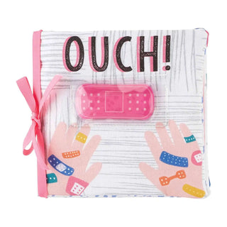 Pink Ouch Pouch baby book with crinkle pages and gel ice pack bandage, designed to comfort little ones through bumps and bruises.