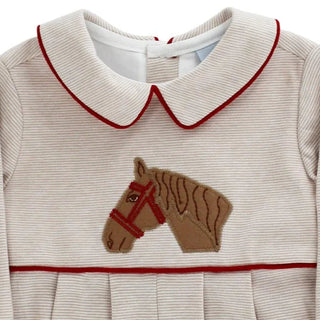 Close up of Bailey Boys Boys Knit Bubble with embroidered pony, red trim, Peter Pan collar, pleated detail, and elastic leg openings.