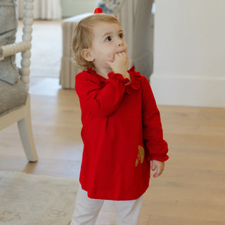 Toddler girl wearing Bailey Boys Pony Pals red tunic with ruffle collar and pony embroidery, paired with coordinating leggings.