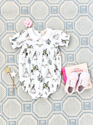 Britt Bubble in Darling Duchess with Palm Beach Pink by The Beaufort Bonnet Company shown with pink shoes and book.