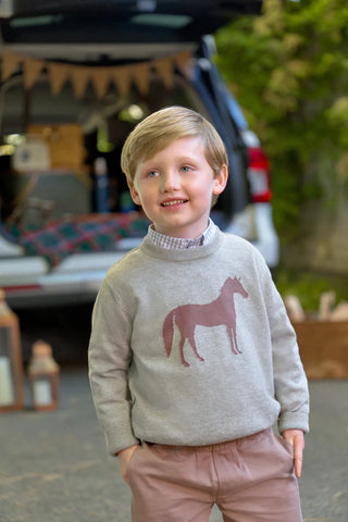 Boy outdoors wearing gray Isaac’s Intarsia Sweater with chestnut horse and pink pants, styled for fall layering and family outings