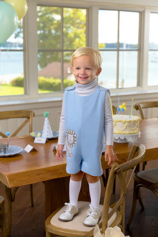 Baby boy’s blue corduroy Jon Jon with playful lion appliqué by The Beaufort Bonnet Company – classic Southern style with whimsical charm.