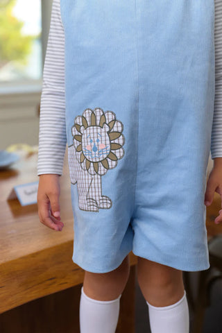 Baby boy’s blue corduroy Jon Jon with playful lion appliqué by The Beaufort Bonnet Company – classic Southern style with whimsical charm.