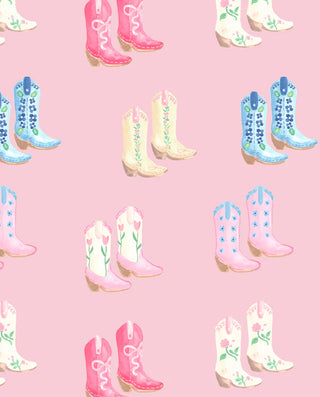 Close-up of pastel cowboy boot pattern on pink background on Maude's Comfy Crewneck from The Beaufort Bonnet Company.
