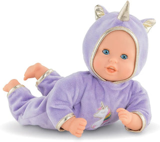 Corolle Bebe Calin Unicorn doll lying on tummy in purple unicorn onesie with gold ears and horn and bright blue eyes.