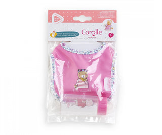 Packaged Corolle baby doll bib and magic milk bottle set shown in clear retail packaging for 36 to 42 cm dolls.