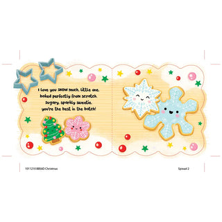 Christmas cookie page spread with frosted snowflake and tree cookies, surrounded by stars and festive decorations.