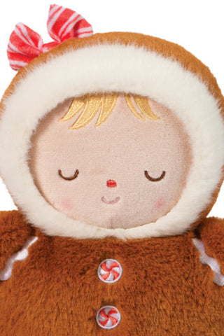 Close up of  Gingerbread Mini Hug Doll with soft brown plush, peppermint buttons, and red-and-white bow 