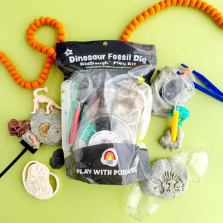 Dinosaur Fossil Dig Play Kit with sensory dough, tools, and realistic fossil figures for imaginative STEM-inspired play.