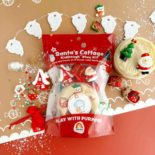 Santa’s Cottage KidDough Play Kit with peppermint-scented dough, gingerbread house toys, and festive Christmas-themed accessories.
