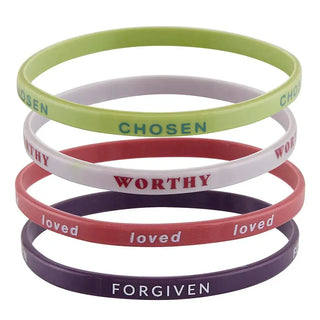 God Calls Me bracelet stack showing Chosen, Worthy, Loved, and Forgiven silicone bracelets in red, green, white, and purple