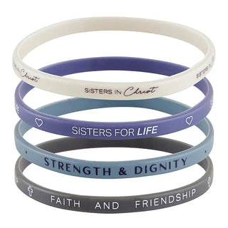 Stack of Sisters in Christ silicone bracelets reading Sisters in Christ, Sisters for Life, Strength and Dignity, Faith and Friendship