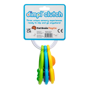 Back view of Fat Brain Toys Dimpl Clutch packaging with three colorful silicone sensory keys on a ring designed for babies