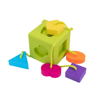 OombeeCube open with shapes shown, demonstrating colorful silicone pieces that encourage early learning, sorting, and sensory fun.