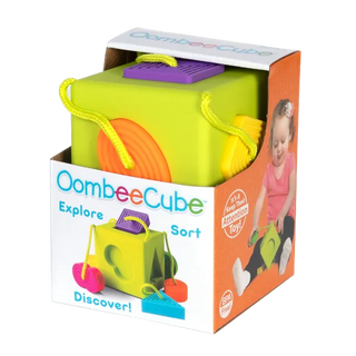 Fat Brain OombeeCube in packaging with flexible silicone shapes attached, promoting fine motor and sensory development.