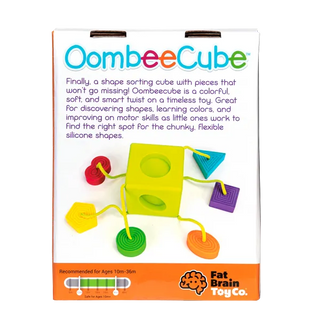 OombeeCube silicone shape sorter with colorful tethered pieces, designed for babies to explore shapes, textures, and motor skills.