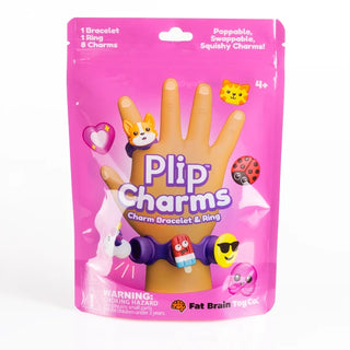 Front of pink Plip Charms pouch with ring and bracelet decorated in rocket pop, smiley face, heart, dog, and pink glitter emoji charms.