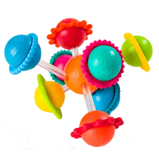 Close-up of Fat Brain Wimzle toy with bright textured balls and silicone spinning rings, perfect for teething and sensory playtime.