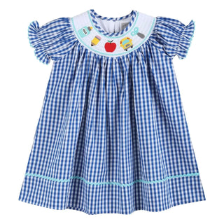 Girls blue gingham smocked school dress with apple, glue, pencil, and bus details—perfect for first day memories.