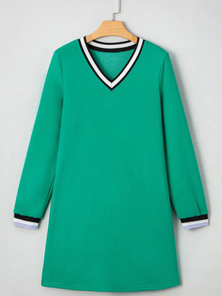 Front view of green long-sleeve varsity dress from Little Daisy Closet on hanger with striped V-neck and matching cuff details.