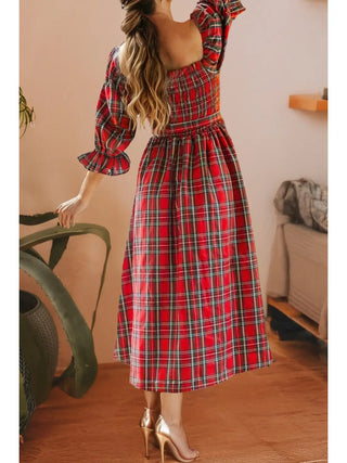 Back view of red plaid holiday midi dress from LDC showing smocked top, puff sleeves, and flowing midi skirt with heels.