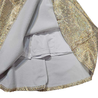 Inside view of Lulu Bebe Metallic Gold skirt showing soft white lining and elastic waistband for comfort and modesty.