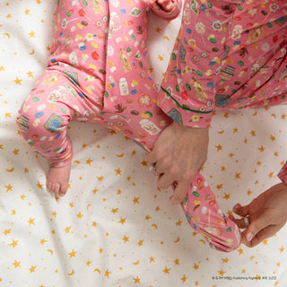 Pink Magnetic Me coverall in Honeydukes pattern with Right Fit technology and magnetic closure.